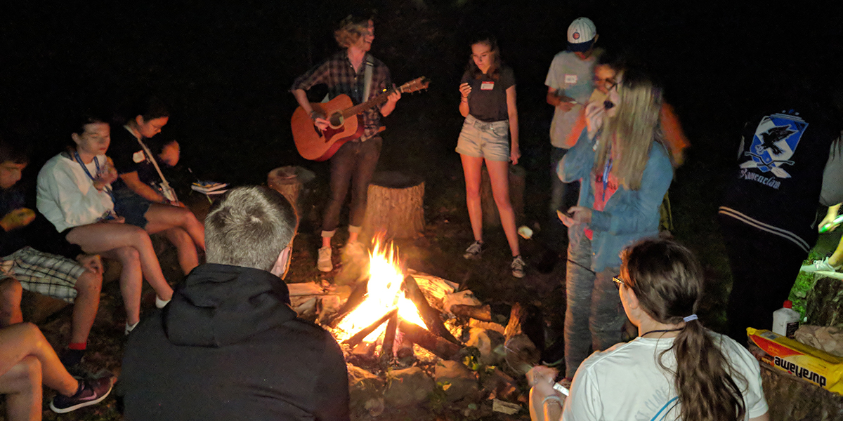 Students around the campfire